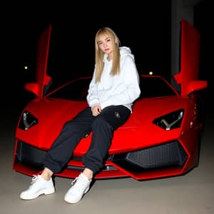 Chic Style: Girl Leaning on a Red Lamborghini