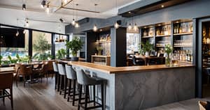 Stylish Bar Design with Pendant Lighting and Plants