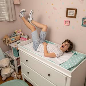 Teenager on Changing Table: Humor & Parenting Insight