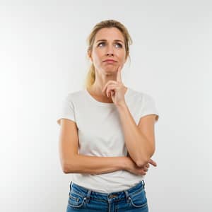 Thoughtful 40-Year-Old Woman in Casual Attire