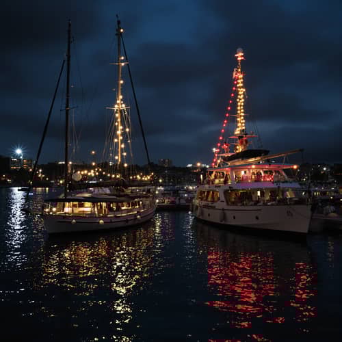 Afro-American Boy at Night by Luxury Boats