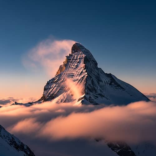 Majestic Snow-Covered Mountain Summit at Sunset