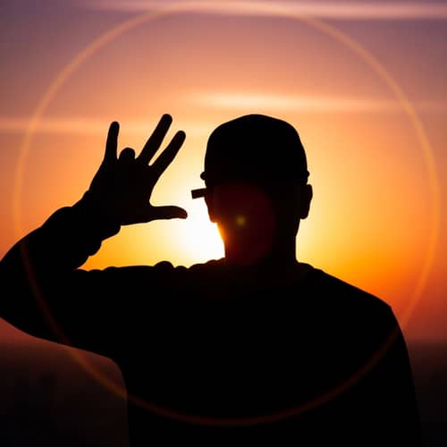 Urban Culture Hand Gesture: Silhouette Person with Cap