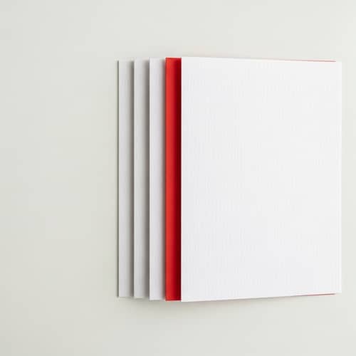 Red Piece of Paper Hidden on White Board