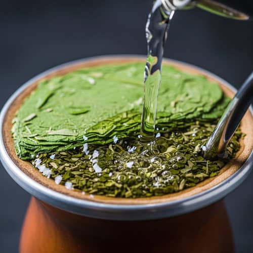 Serene Yerba Mate Ritual: Water Pouring on Leaves in Traditional Gourd