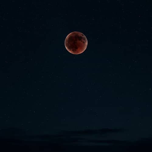 Captivating Blood Moon in Dark Starry Sky