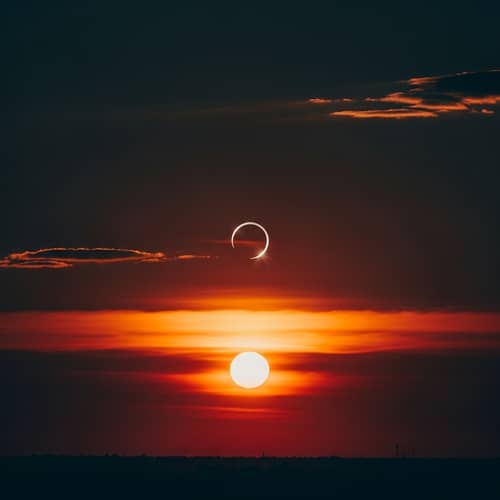 Sunset Eclipse: Celestial Event of Orange, Pink & Red Hues
