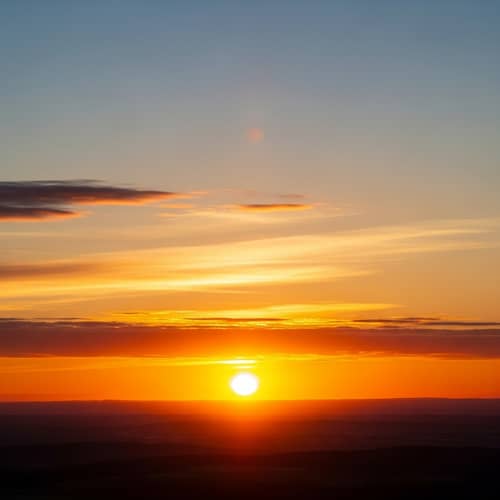 Breathtaking Sunset Scene - Serene Blues to Fiery Reds