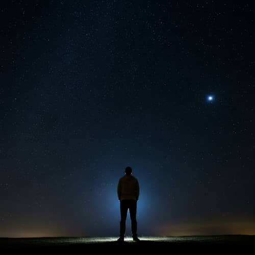 Hispanic Man Under Dark Starlit Sky