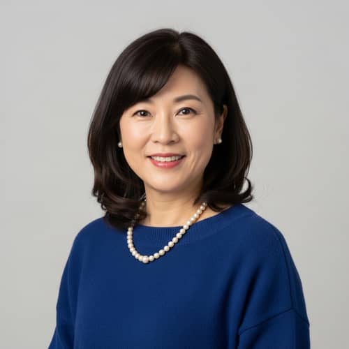 Middle-Aged Asian Woman with Wide Features and Long Bob Haircut