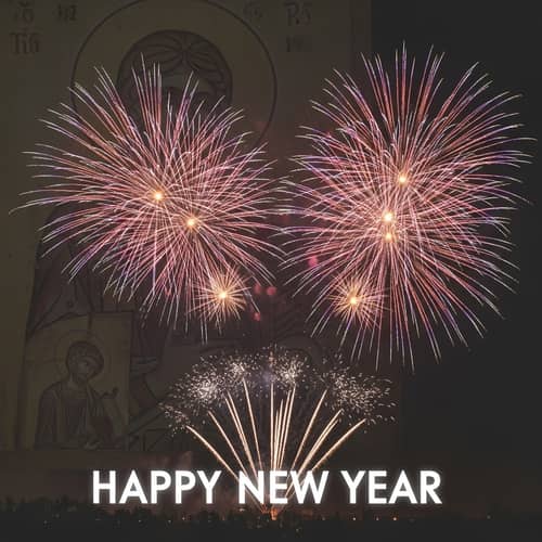 Vibrant New Year Fireworks with Serene Religious Figure