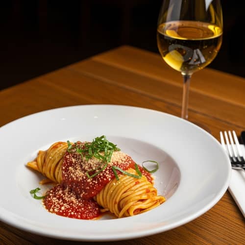 Delicious Tucked-In Pasta Dish with Marinara Sauce and Parmesan Cheese