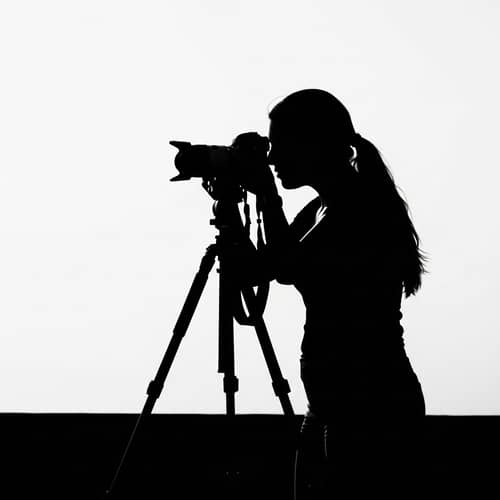 Silhouette Drawing of Hispanic Female Photographer Taking Picture