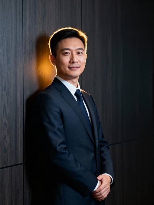 Confident Boardroom Portrait with Dramatic Lighting