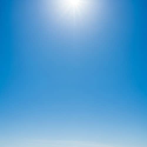 Vivid Azure Blue Sky on a Clear Day | Vibrant Sunlight Scene