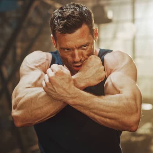Flexing Biceps Pose with Intense Veins