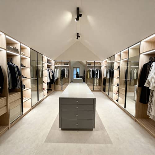 Elegant Sloped-Ceiling Walk-In Closet Design Elegant Sloped-Ceiling Walk-In Closet Design