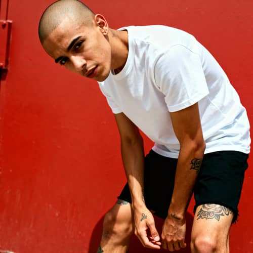 Skinny Rapper in White Shirt and Black Shorts