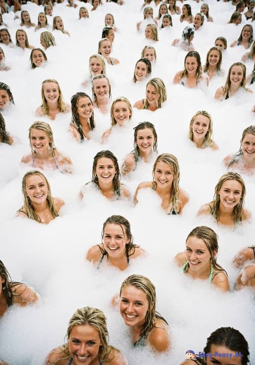 Fun at a University Foam Party: College Women Smiling