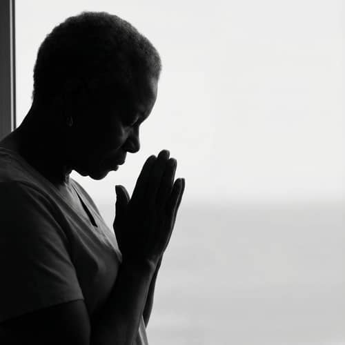 Silhouette of an African-American Woman Praying Silhouette of an African-American Woman Praying