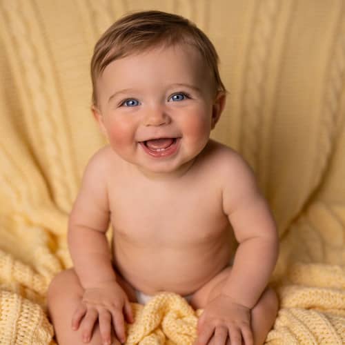 Joyful One-Year-Old Baby with Light Blue Eyes