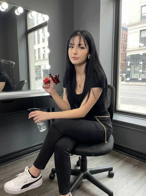 Stylish Tattoo Artist with Long Black Hair Stylish Tattoo Artist with Long Black Hair