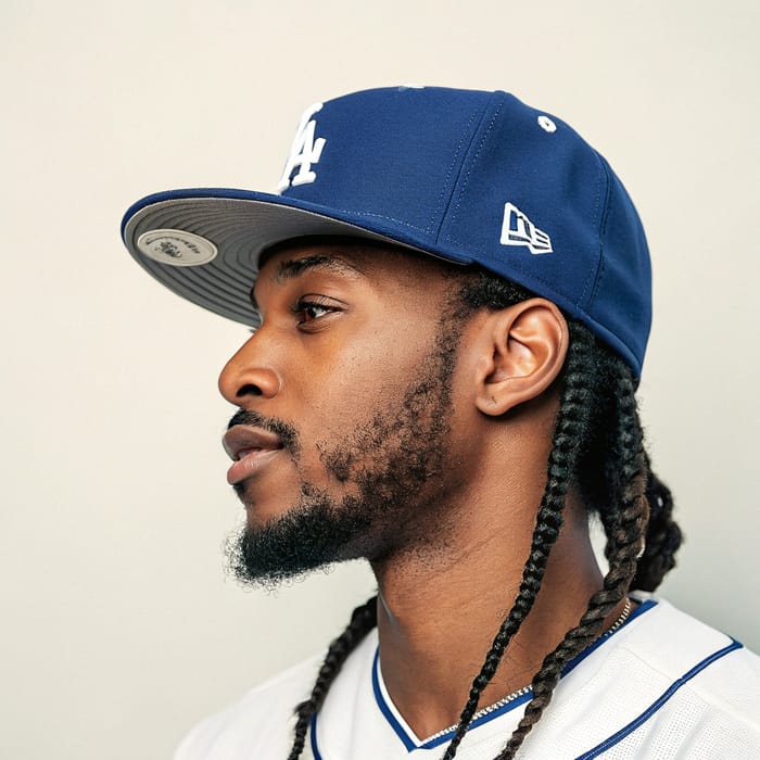 Stylish Black Man with Cornrows and Dodgers Hat