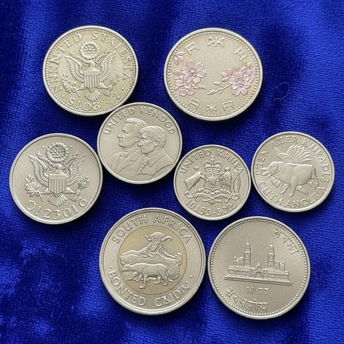 Official Coins: Global Collection on Blue Velvet Fabric Featuring Distinctive Coins from Various Countries
