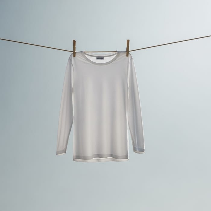 White Long-Sleeve Shirt Hanging on Clothespins | Blue Sky Background