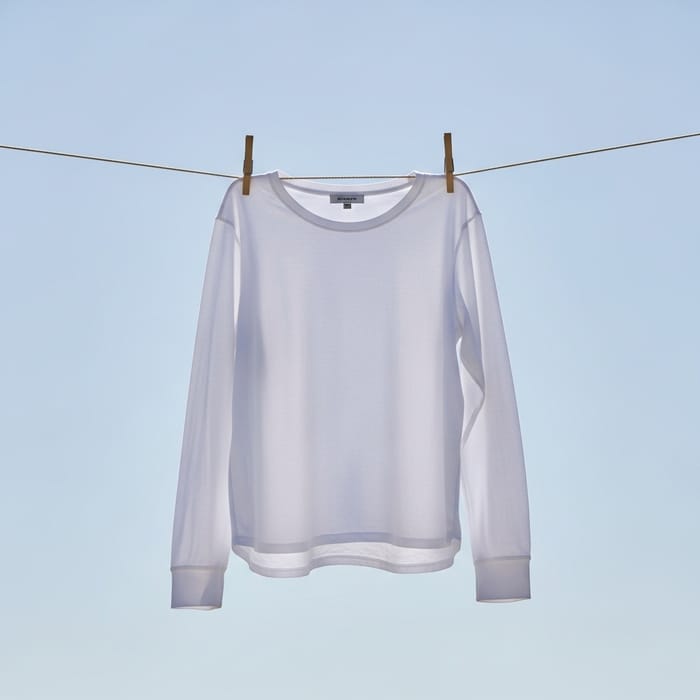 Solid White Long Sleeve Shirt | Close-Up on Blue Sky Solid White Long Sleeve Shirt | Close-Up on Blue Sky