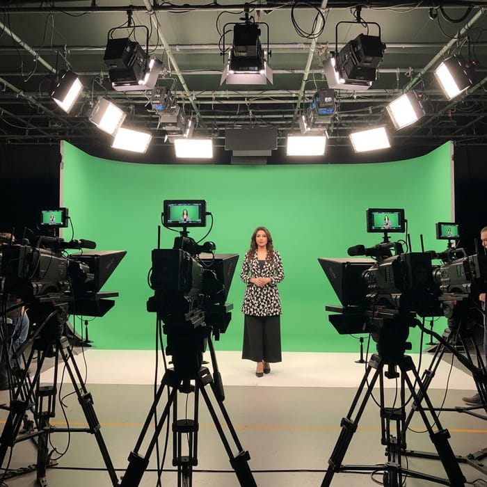 Professional Studio Three-Camera Setup with Presenter in Action Professional Studio Three-Camera Setup with Presenter in Action