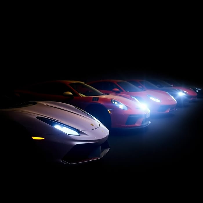 Supercars Illuminated Against Dark Background