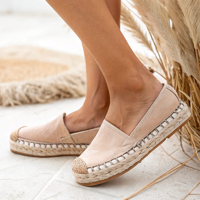 Stylish Female Feet in Espadrilles