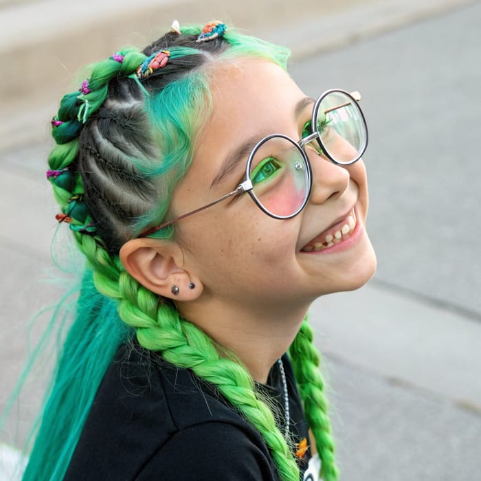 Stylish Girl with Big Glasses and Green Hair