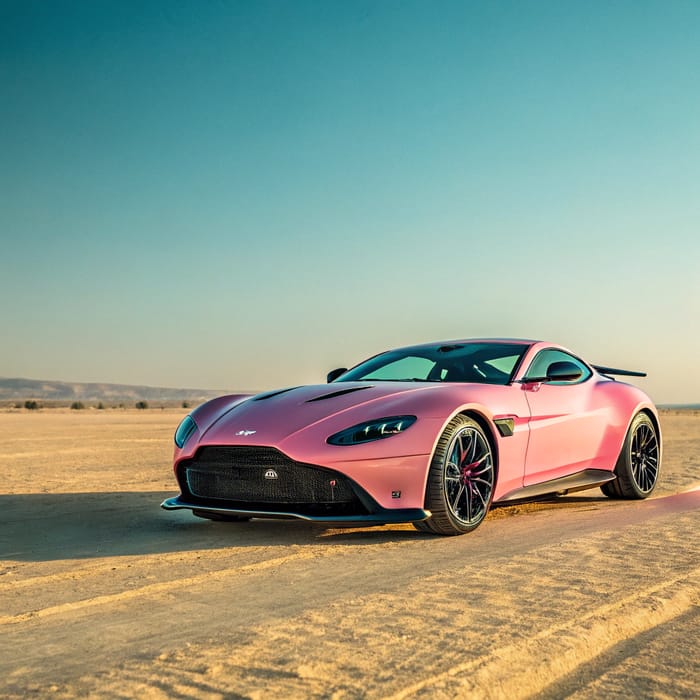 Flat Pink Aston Martin Hypercar in Yellow Desert