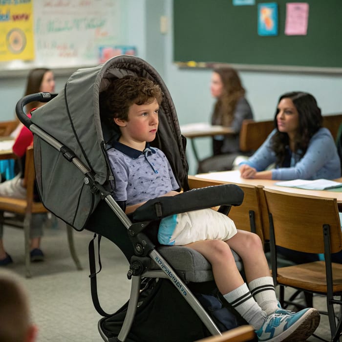 Teen in Diaper and Stroller at Class