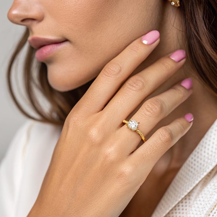 Elegant Gold Ring with Diamond on Woman's Hand