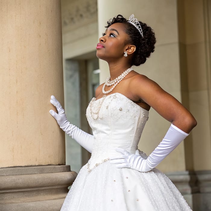 Elegant Debutante in White Gown with Pearls