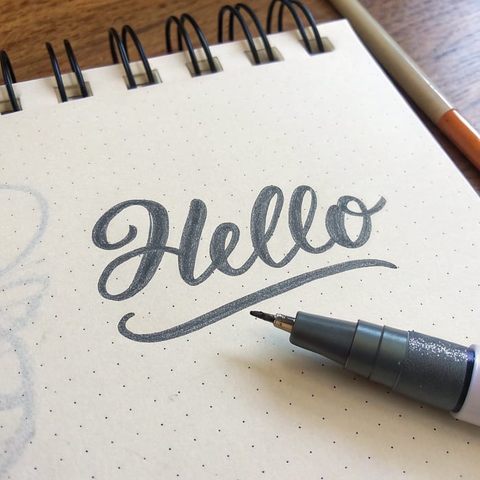 Realistic Pen Mark of 'Hello' on Notebook