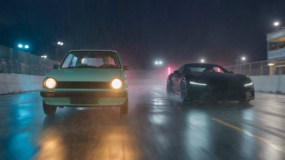 Mint-green hatchback and black sports coupe racing side by side on a wet track at night in an AI short film made with Seedance 2.5