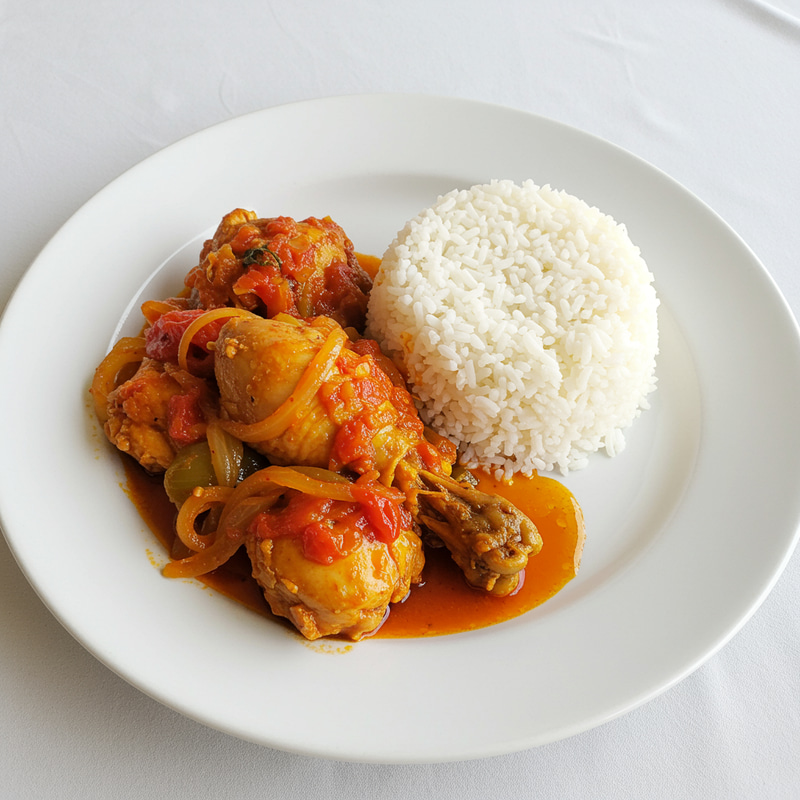 Delicious African Chicken in Tomato Sauce with Rice