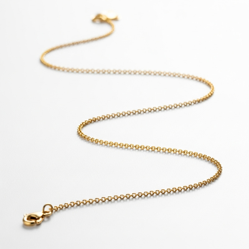 Thin Gold Chain on White Background Thin Gold Chain on White Background
