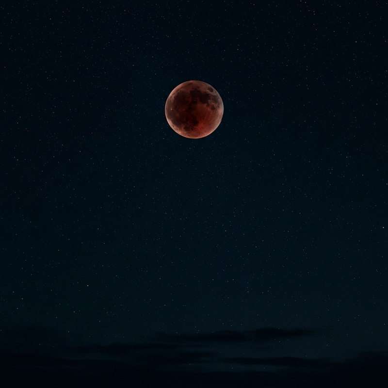 Spectacular Blood Moon in Starry Night Sky Spectacular Blood Moon in Starry Night Sky