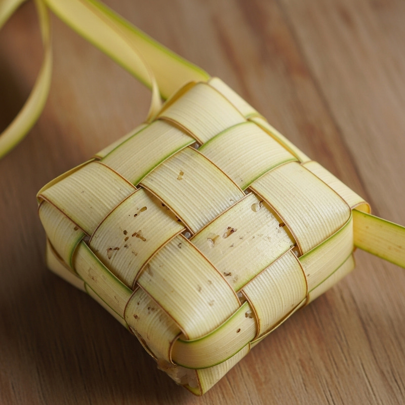 Ketupat: Diamond-shaped Rice-Filled Palm Leaf Pouch Ketupat: Diamond-shaped Rice-Filled Palm Leaf Pouch