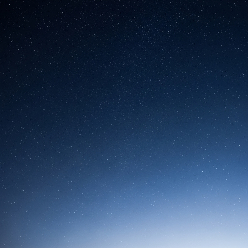 Serenity in Blue: Tranquil Night Sky with Sparkling Stars