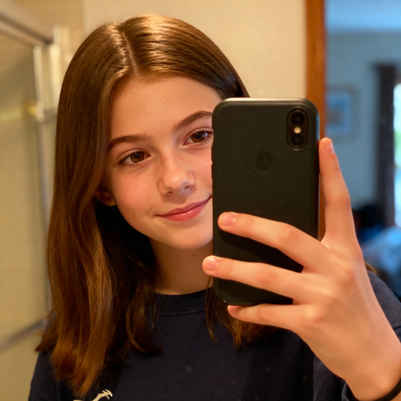 16-Year-Old Girl Taking a Stylish Selfie 16-Year-Old Girl Taking a Stylish Selfie