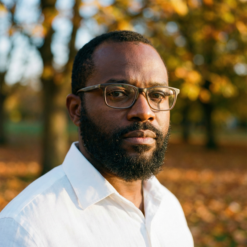 Serious Portrait of a 44-Year-Old Man in White Shirt Serious Portrait of a 44-Year-Old Man in White Shirt