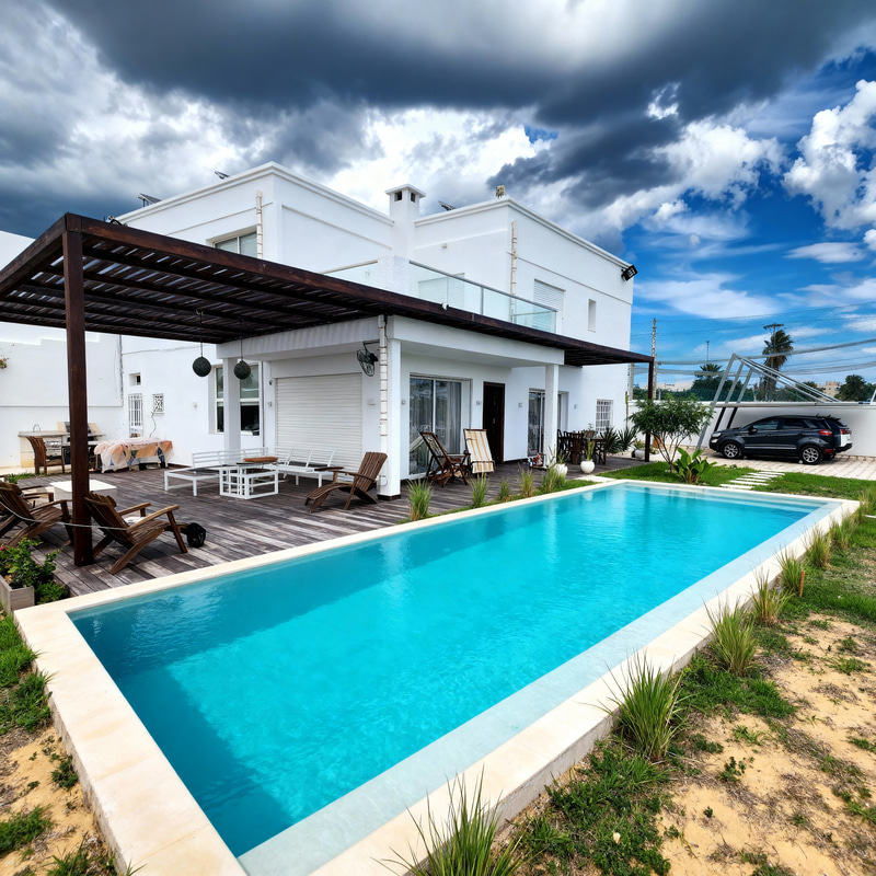 Lagoon Pool Design Next to Wooden Deck