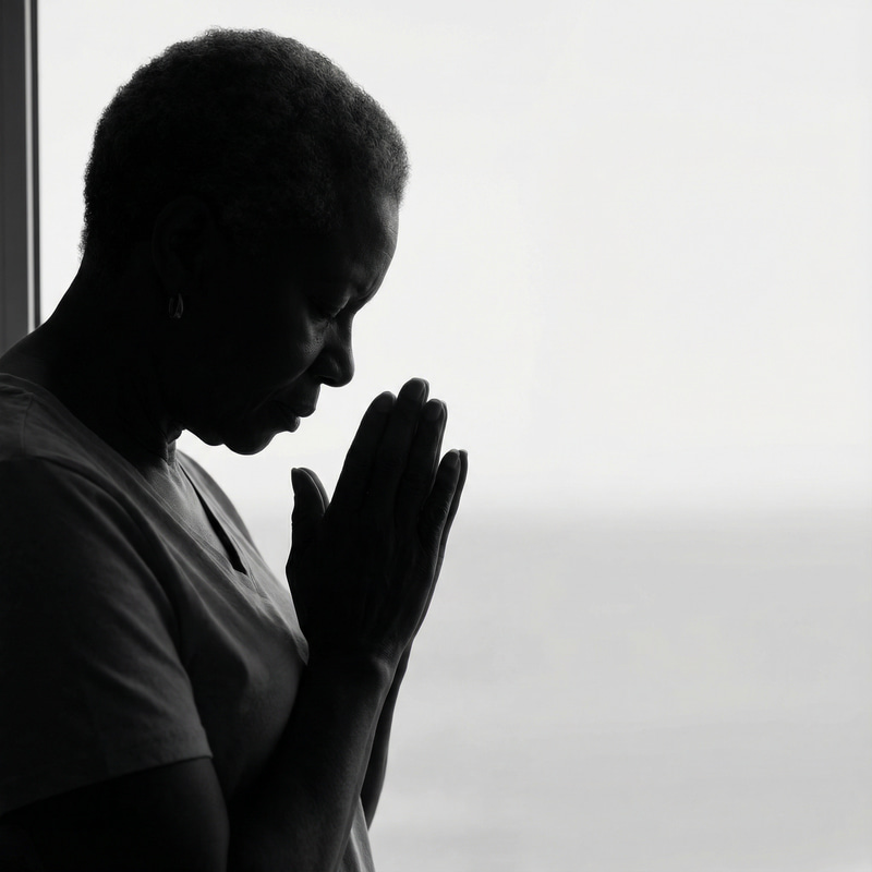 Silhouette of an African-American Woman Praying Silhouette of an African-American Woman Praying