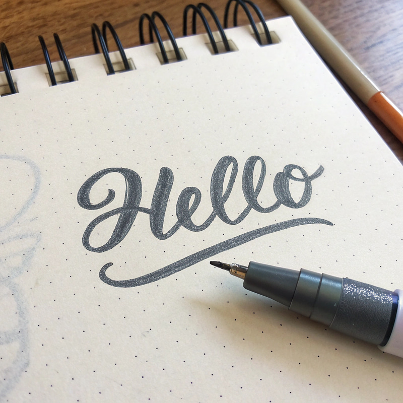 Realistic Pen Mark of 'Hello' on Notebook Realistic Pen Mark of 'Hello' on Notebook